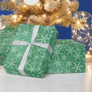 Weihnachts-Winterschneeflocken fallen grün Geschenkpapier