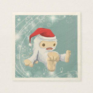 Weihnachts-Yeti-Puppe Eine Weihnachtsmannmütze tra Serviette