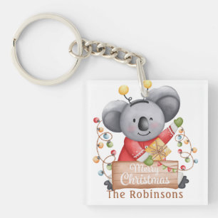 Weihnachtsbär mit Geschenk und Schneeflocken Schlüsselanhänger