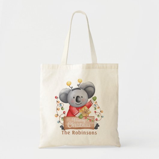 Weihnachtsbär mit Geschenk und Schneeflocken Tragetasche (Vorne)