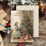 Weihnachtsbaum Girl Geschenke Feiertagskarte<br><div class="desc">Weihnachts-Grußkarte mit einem Vintagen Bild eines Mädchens, das einen Weihnachtsbaum mit eingewickelten Geschenken unter sich schmückt. Text sagt, "Frohe Weihnachten", aber ist für Ihre eigenen Gruß anpassbar. Personalisiert auf der Rückseite mit Ihrer Nachricht und Ihrem Namen. Kontaktieren Sie mich für Hilfe bei Ihrer Anpassung oder um zusätzliche Matching oder Koordination...</div>