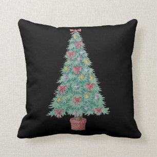 Weihnachtsbaum mit Dekorationsrot beugt Kissen