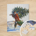 Weihnachtsbaum | N.C. Wyeth Puzzle<br><div class="desc">Weihnachtsbaum - Chadd Ford (1922) | N.C. Wyethes Gemälde 1922, Christbaum - Chadd Ford, fasziniert wunderbar eine winterliche Weihnachtsszene eines Mannes, der einen frisch geschnittenen Baum durch die schneebedeckte Landschaft von Chadd Ford, Pennsylvania trägt. Der Mann ist herzlich gebündelt, mit seiner robusten Haltung, die die Anstrengung, den vollen, lebendigen Baum...</div>