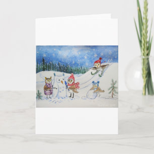 Weihnachtseulen, die im Schnee spielen Feiertagskarte