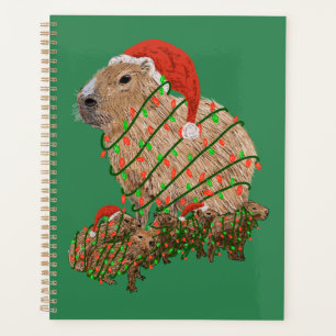 Weihnachtsfamilie Capybara eingewickelt in Lichter Planer