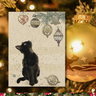 Weihnachtsfeiertag Schwarze Katze Blick auf Orname Feiertagspostkarte