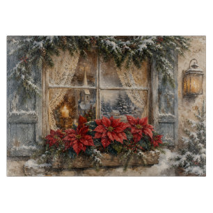 Weihnachtsfenster mit Poinsettien im Schnee Schneidebrett