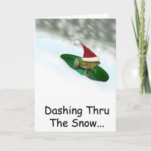 Weihnachtsfrosch rast durch den Schnee auf einem S Feiertagskarte