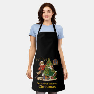 Weihnachtsfuchs und -katze schmücken den Baum Schürze
