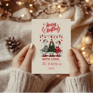 Weihnachtsgänse in gemütlichen Pullovern Feiertagskarte