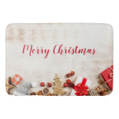 Weihnachtsgeschenkartikel auf einem rustikalen Hol Badematte (Vorderseite)