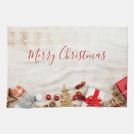 Weihnachtsgeschenkartikel auf einem rustikalen Hol Geschirrtuch