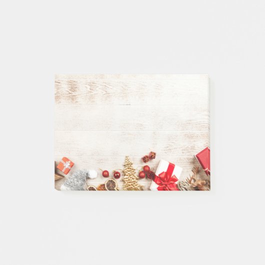 Weihnachtsgeschenkartikel auf einem rustikalen Hol Post-it Klebezettel (Vorderseite)