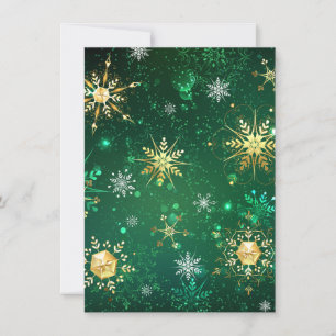 Weihnachtsgoldschneeflocken auf grünem Hintergrund Einladung