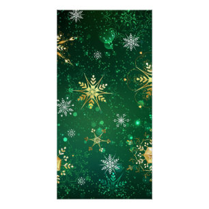 Weihnachtsgoldschneeflocken auf grünem Hintergrund Poster