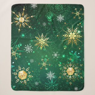 Weihnachtsgoldschneeflocken auf grünem Hintergrund Sherpadecke
