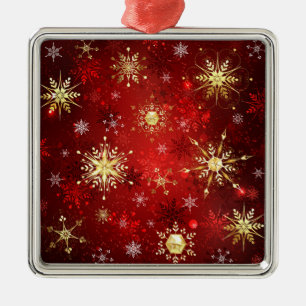 Weihnachtsgoldschneeflocken auf rotem Hintergrund Ornament Aus Metall