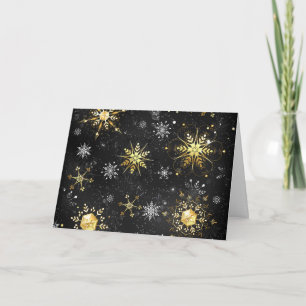 Weihnachtsgoldschneeflocken auf schwarzem Hintergr Einladung
