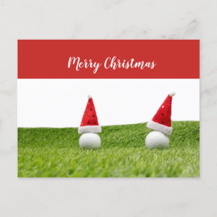 Weihnachtsgolf mit Golfball und Santa-Hut Feiertagspostkarte