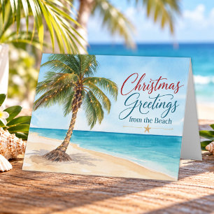 Weihnachtsgrüße von der tropischen Palme am Strand Feiertagskarte