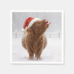 Weihnachtshochlandkuh fängt Schneeflocken Serviette