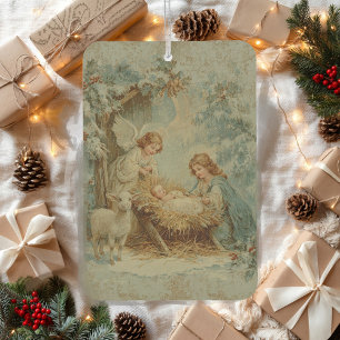 Weihnachtskarte mit Baby Jesus in einer Krippe und Autolufterfrischer
