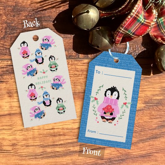 Weihnachtskarte mit Pinguin und Weihnachtsstern in Geschenkanhänger