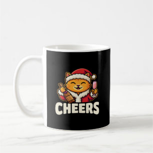 Weihnachtskatze bejubelt festliches Trinken Kaffeetasse