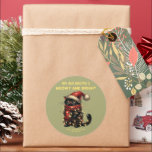 Weihnachtskatze individuell anpassbar runder aufkleber<br><div class="desc">Eine niedliche Katze, die eine Weihnachtsmannmütze trägt und in Weihnachtsbeleuchtung eingewickelt ist. Der Text ist anpassbar. Sie können es ändern oder sogar löschen. Brauchst du Hilfe? Wenn Sie Hilfe in Bezug auf die Grafik oder eine weitere Anpassung benötigen, lass mir Bescheid, indem du mich kontaktierst. (Klicken Sie auf den Button...</div>