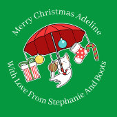 Weihnachtskatze mit rotem Regenschirm auf Grün Geschenkpapier