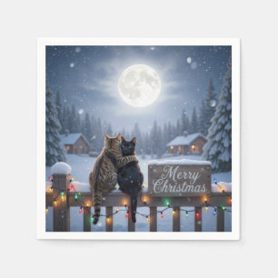 Weihnachtskatzen umarmen sich auf einem schneebede serviette