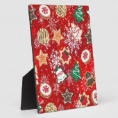 Weihnachtskekse und Schneeflocken auf Rot Fotoplatte (Seite)