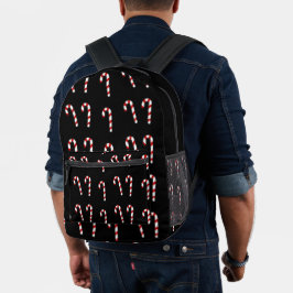 Weihnachtskerzenrohr auf schwarz bedruckter rucksack