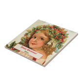 Weihnachtskind Holly Verlasse in ihrem Haar Fliese (Seite)