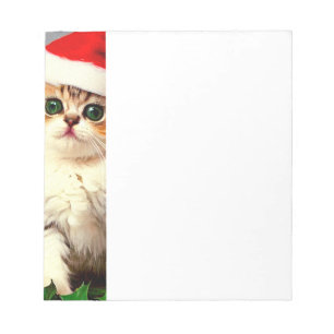 Weihnachtskitten in Weihnachtsmannmütze Notizblock