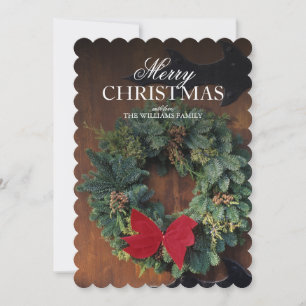 WeihnachtsKranz auf hölzerner Tür Feiertagskarte
