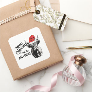 Weihnachtskühe mit Weihnachtsmannmütze Quadratischer Aufkleber