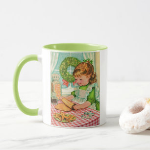Weihnachtsmädchen der 1950er Jahre backen Cookies Tasse