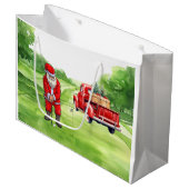 Weihnachtsmann am Golf mit rotem LKW auf Grün Große Geschenktüte (Vorderseite Schrägansicht)
