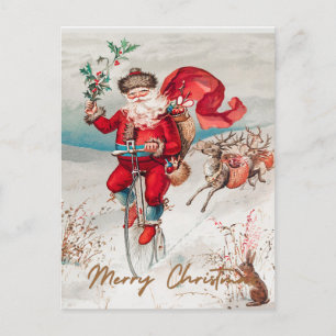 Weihnachtsmann auf einem Hochrad mit Rentieren Feiertagspostkarte