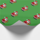 Weihnachtsmann, der Saxophon-Packpapier spielt Geschenkpapier (Ecke)