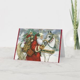 Weihnachtsmann, der seinem weißen Pferd Futter gib Feiertagskarte