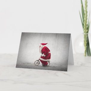 Weihnachtsmann fährt Fahrrad Feiertagskarte