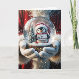 Weihnachtsmann hält eine Schneekugel mit Pinguin Feiertagskarte