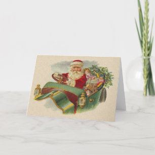Weihnachtsmann im klassischen Antiquitäten-Auto Feiertagskarte