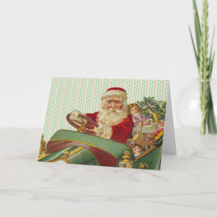Weihnachtsmann im klassischen Antiquitäten-Auto Feiertagskarte