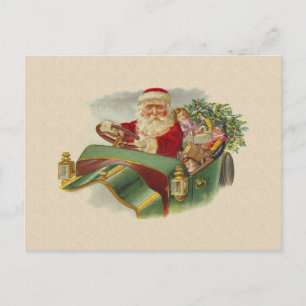 Weihnachtsmann im klassischen Antiquitäten-Auto Feiertagspostkarte