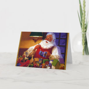 Weihnachtsmann im Spielzeug-Geschäft Feiertagskarte