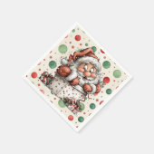 Weihnachtsmann kriecht aus Geschenkbox Serviette (Ecke)