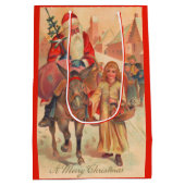 Weihnachtsmann reitet einen Esel Frohe Weihnachten Mittlere Geschenktüte (Rückseite)